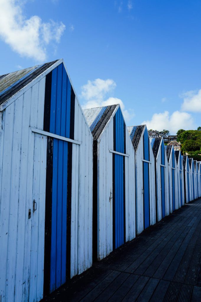 White and Blue Beach Huts by the Seaside
